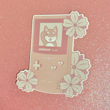 Sakura Good Luck Gameboy with Gojira the Shiba Inu Pink Sticker