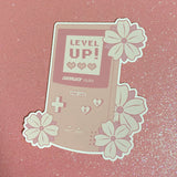 Sakura Level Up! Good Luck Gameboy Pink Sticker